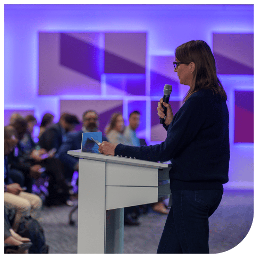 woman standing at podium 