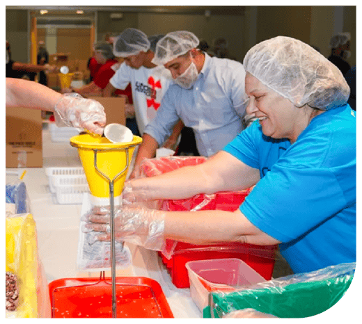 Volunteers making food packs